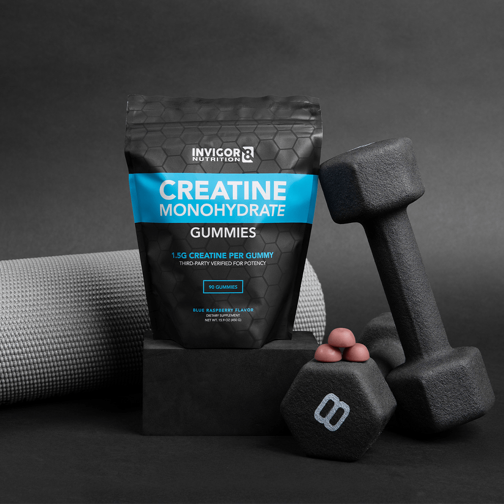 creatine gummies package with gummies and weights and yoga matt