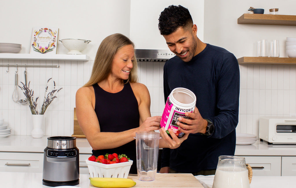  Man and woman preparing an INVIGOR8 protein shake