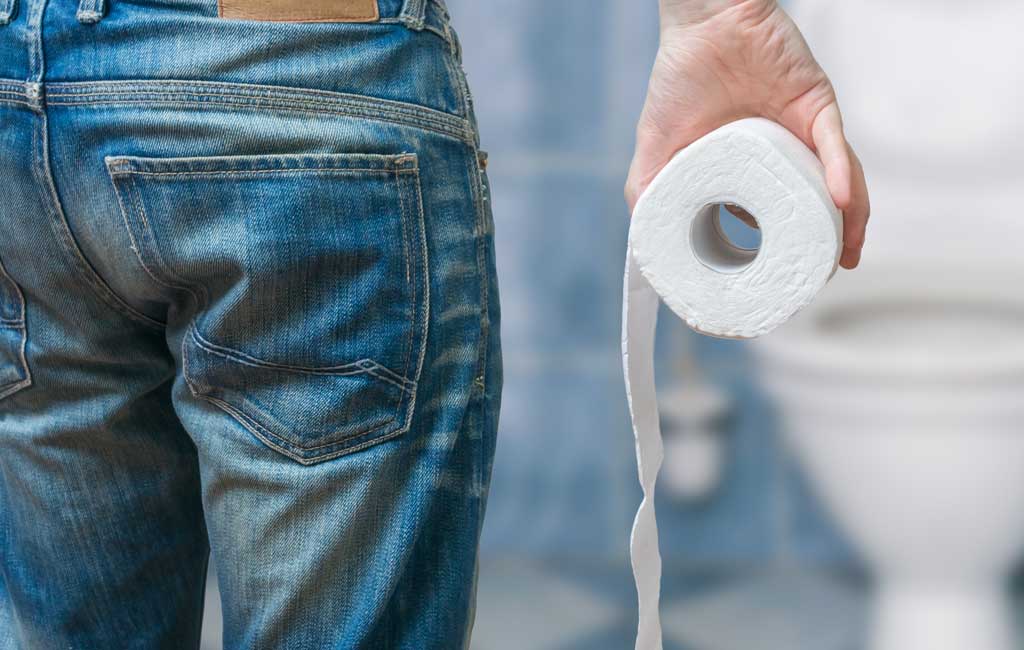 person holding toilet paper