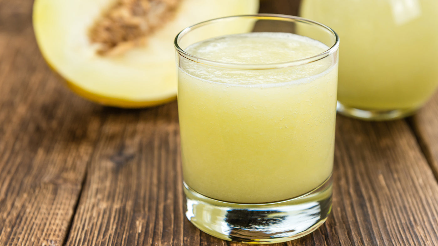  kiwi and honeydew smoothie on a table