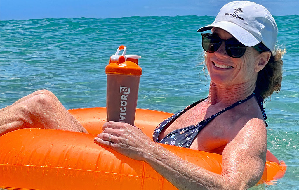 woman in the water with INVIGOR8 shake