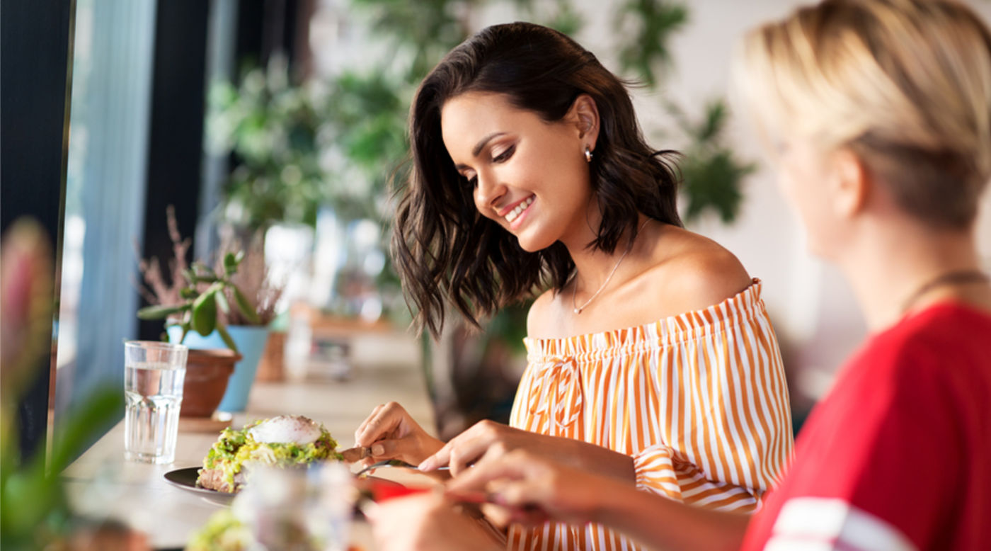  two women eating out