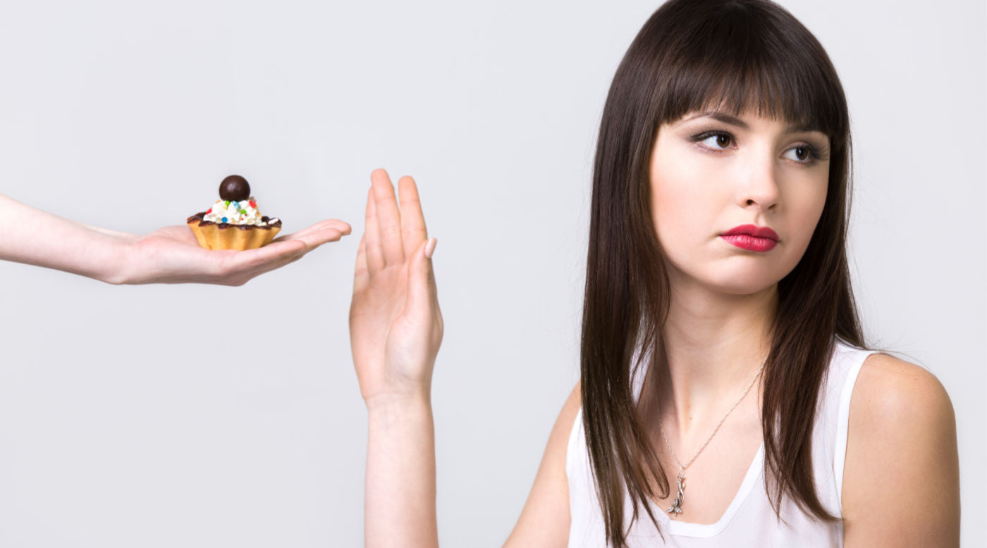 Woman refusing dessert