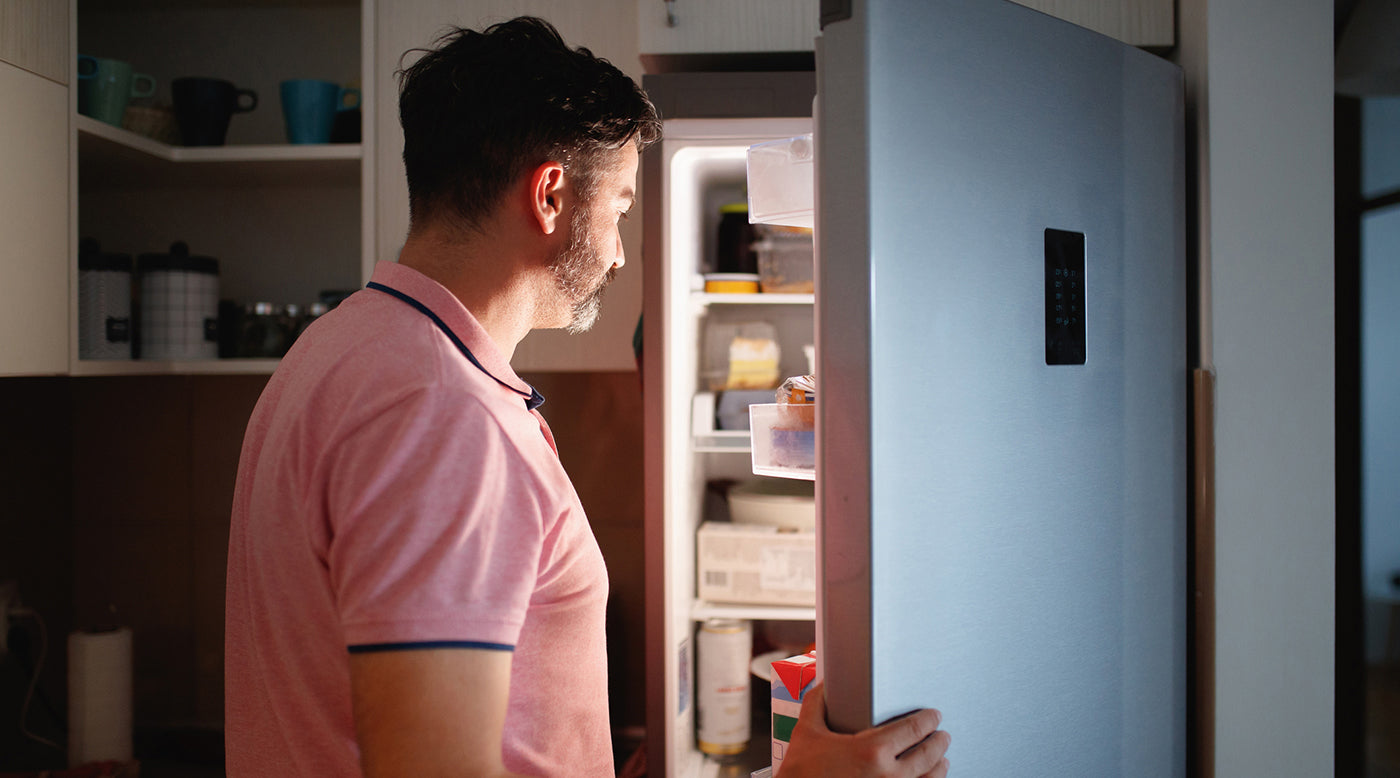  man looking in fridge