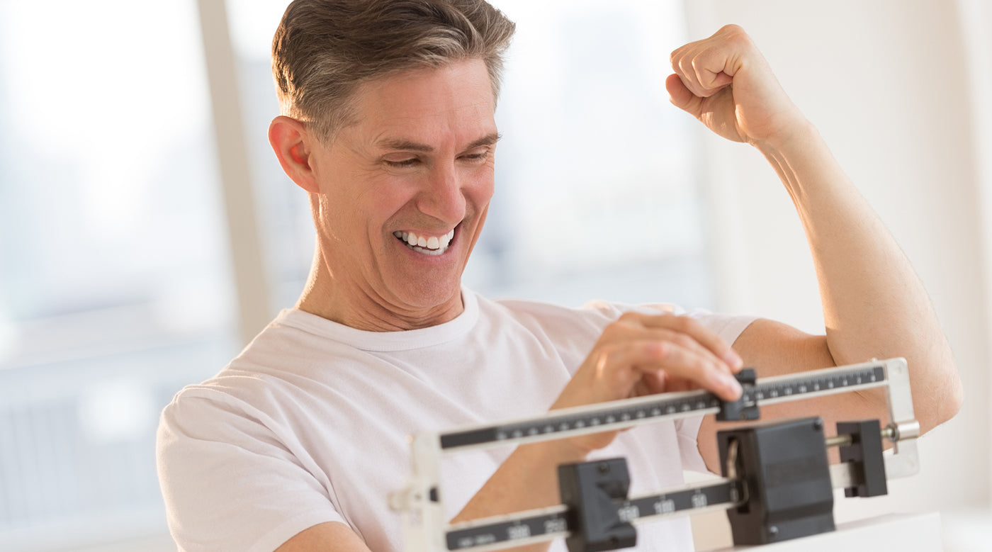 man smiling on scale