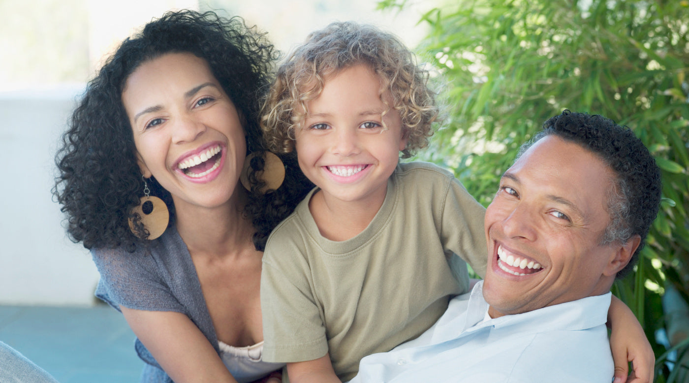  middle-age bi-racial couple with young boy