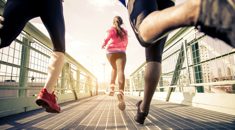 people running across bridge