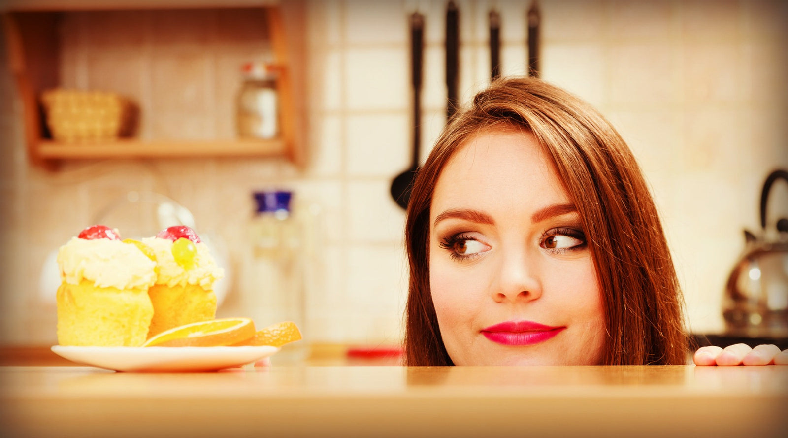  woman staring at a cupcake