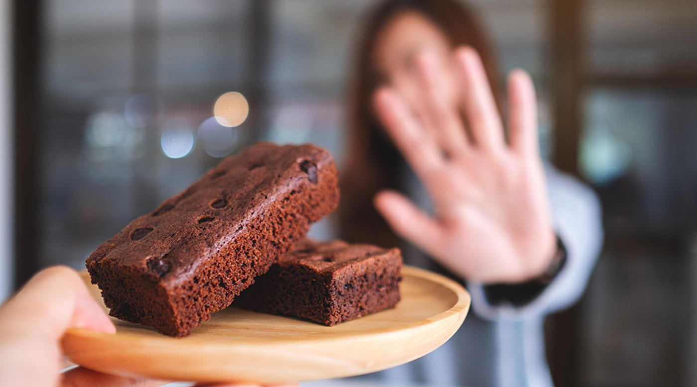  woman refusing brownies