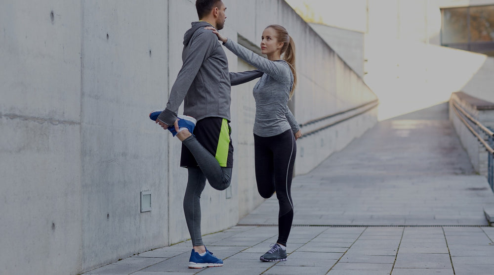 workout partners stretching before running