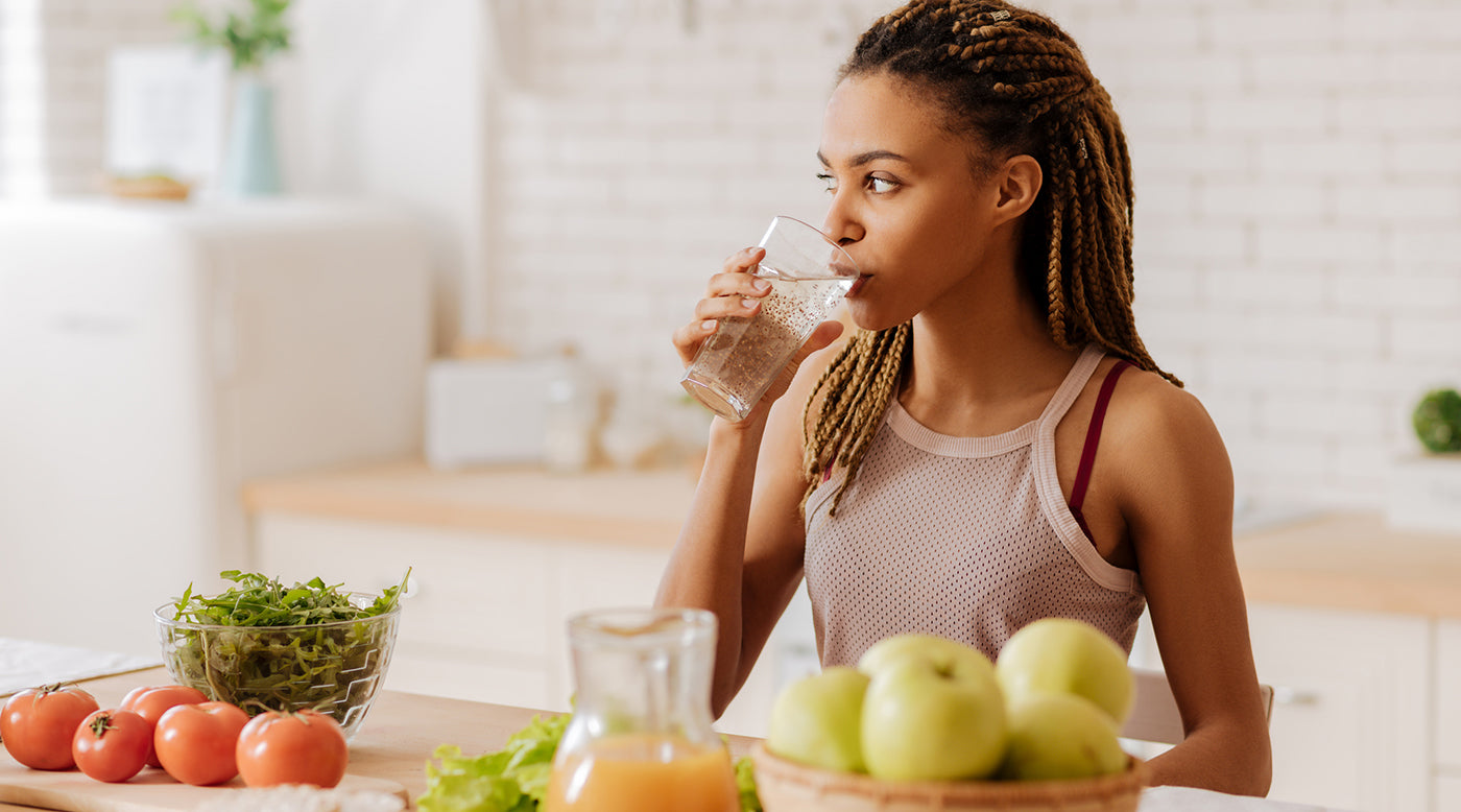  young fit woman drinking water